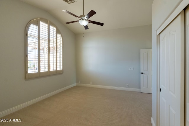 9571 E Nittany Dr, Scottsdale, AZ 85255 - spare room featuring lofted ceiling, light colored carpet, and a ceiling fan