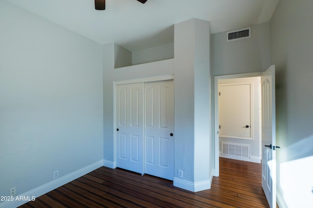 9571 E Nittany Dr, Scottsdale, AZ 85255 - unfurnished bedroom featuring dark wood-style flooring, a closet, and a ceiling fan