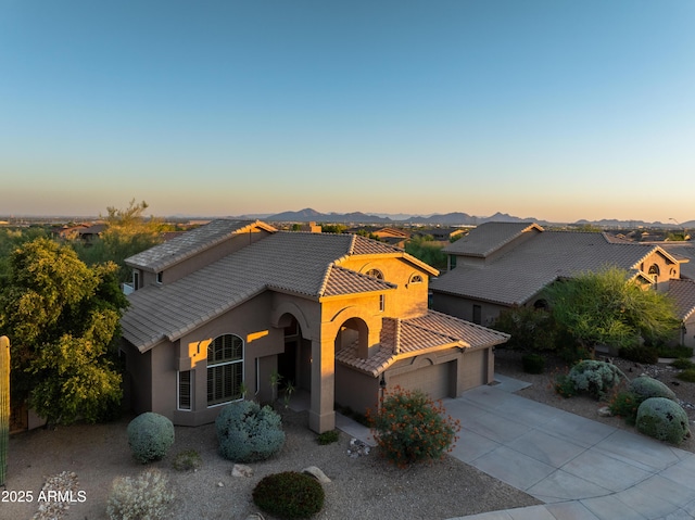 9571 E Nittany Dr, Scottsdale, AZ 85255 - mediterranean / spanish house with a tiled roof, an attached garage, stucco siding, and concrete driveway
