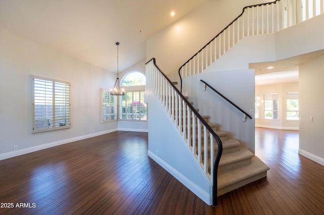9571 E Nittany Dr, Scottsdale, AZ 85255 - staircase featuring a towering ceiling, a chandelier, wood finished floors, and recessed lighting