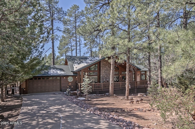 view of front facade with concrete driveway and an attached garage