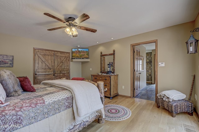 bedroom featuring light wood finished floors and ceiling fan