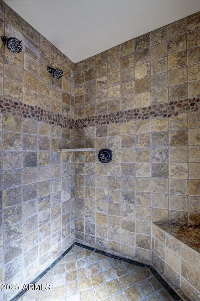 full bath with tiled shower