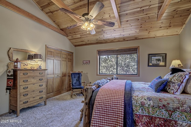 bedroom with a ceiling fan, lofted ceiling, wood ceiling, a closet, and light carpet