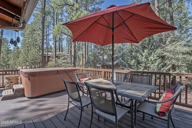 wooden deck with a hot tub and outdoor dining area