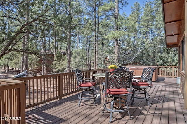 wooden terrace featuring outdoor dining space