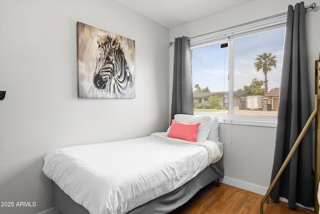 bedroom featuring dark wood-type flooring