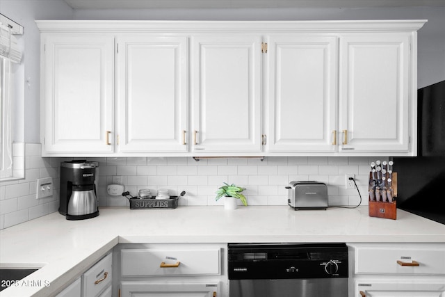 kitchen with white cabinetry, decorative backsplash, and dishwasher