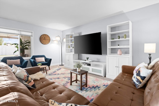 living room featuring built in shelves