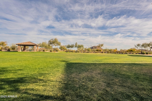 view of property's community featuring a yard and a gazebo