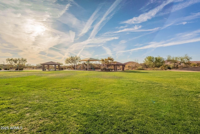 view of yard featuring a gazebo and playground community