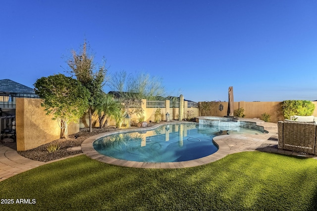 view of pool with a yard, a patio area, a fenced backyard, and a pool with connected hot tub