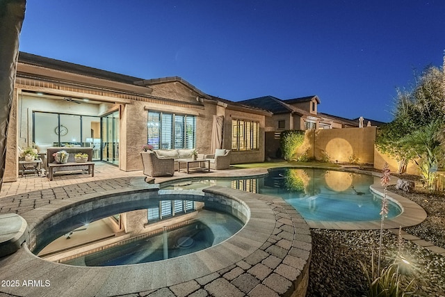 view of swimming pool featuring a fenced in pool, an outdoor hangout area, a patio area, fence, and an in ground hot tub