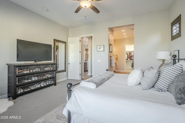 carpeted bedroom featuring visible vents, a ceiling fan, and baseboards