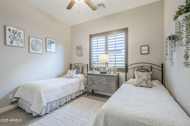 carpeted bedroom featuring visible vents, ceiling fan, and baseboards