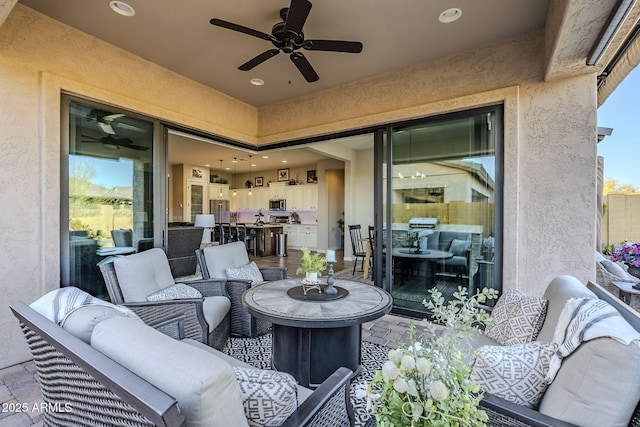 view of patio / terrace featuring outdoor lounge area and a ceiling fan