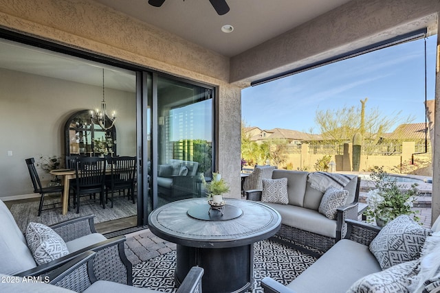 view of patio / terrace with a ceiling fan and an outdoor living space