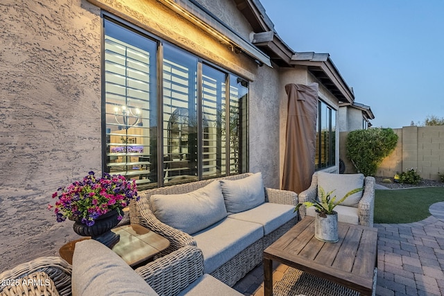 view of patio / terrace with outdoor lounge area and fence