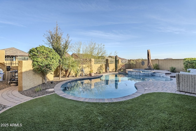 view of pool with a yard, a patio area, a fenced backyard, and a pool with connected hot tub