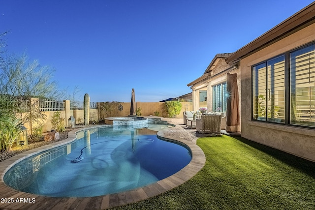 view of pool featuring a patio area, a fenced backyard, and a pool with connected hot tub