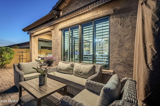 exterior space with an outdoor hangout area and a patio