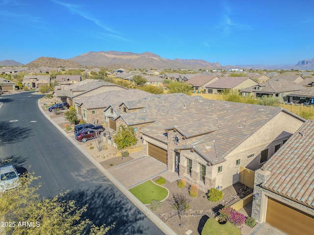 drone / aerial view featuring a residential view and a mountain view