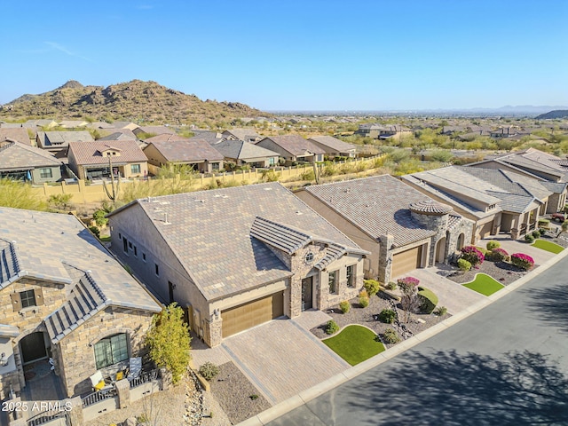 birds eye view of property with a mountain view and a residential view