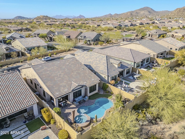 drone / aerial view featuring a mountain view and a residential view