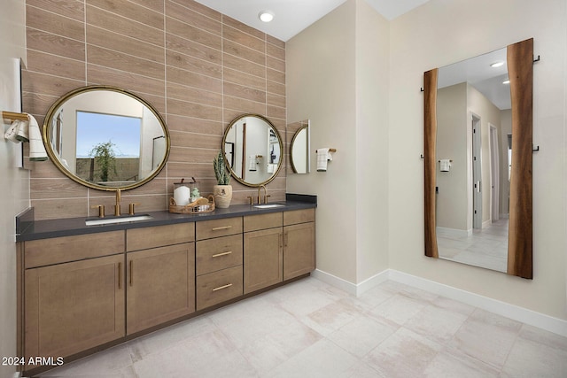 bathroom featuring tile walls and vanity