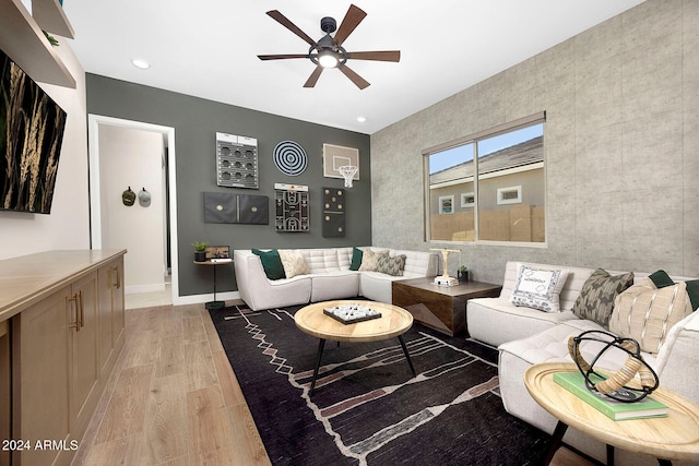 living room featuring light wood-type flooring and ceiling fan