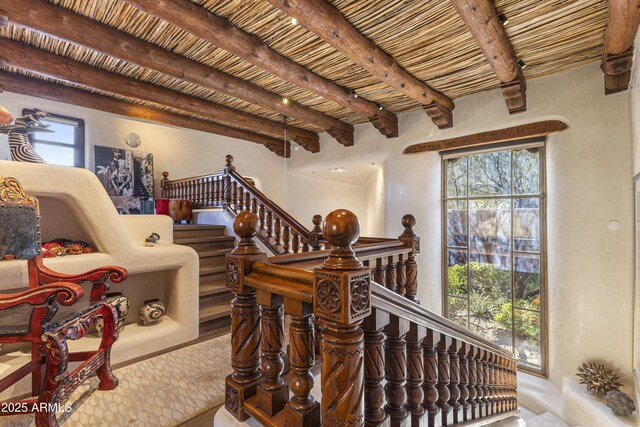 staircase with beam ceiling and wooden ceiling