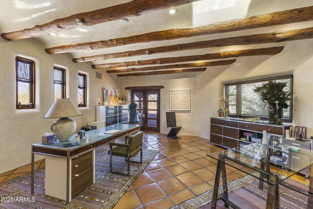 office space featuring french doors, beamed ceiling, and dark tile patterned floors