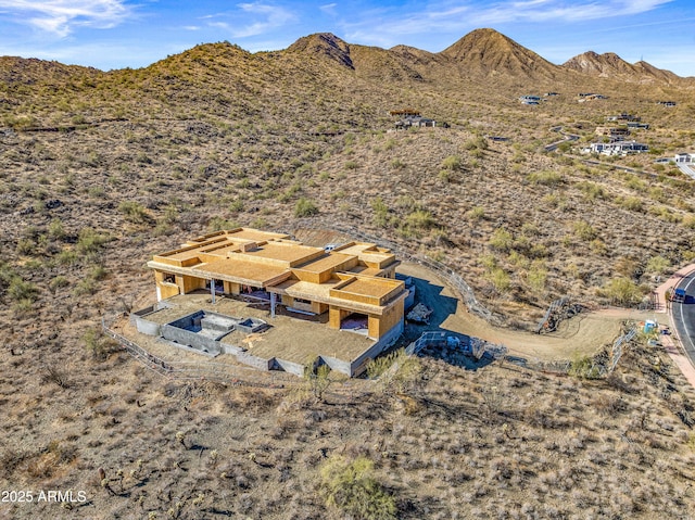 drone / aerial view featuring a mountain view