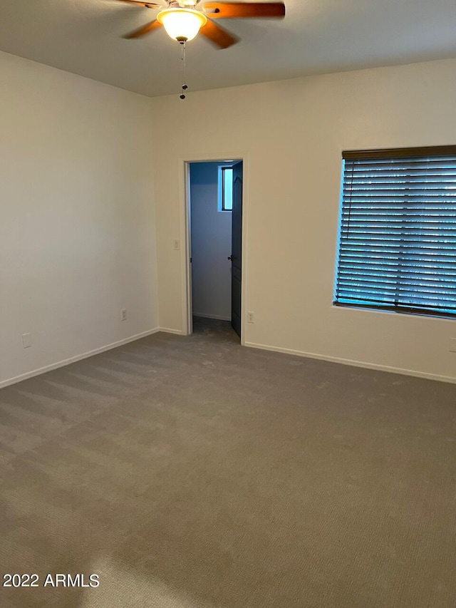 9070 E Gary Rd Unit 152, Scottsdale, AZ 85260 - carpeted spare room featuring a ceiling fan and baseboards