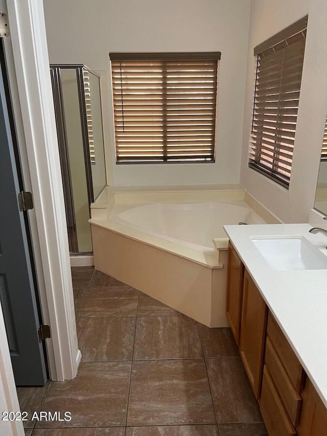 9070 E Gary Rd Unit 152, Scottsdale, AZ 85260 - bathroom featuring a garden tub, a shower stall, vanity, and tile patterned floors