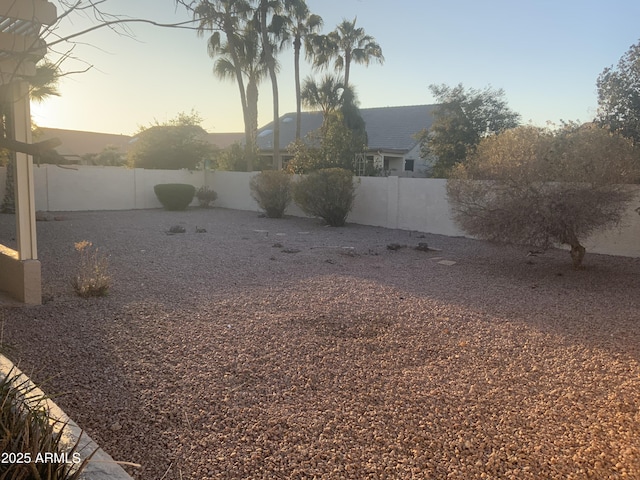 view of yard at dusk