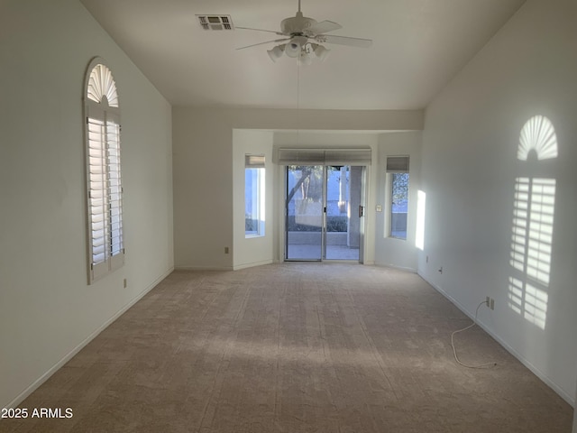 carpeted empty room with ceiling fan