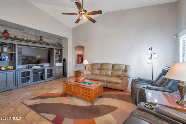 tiled living area with arched walkways, visible vents, high vaulted ceiling, and a ceiling fan