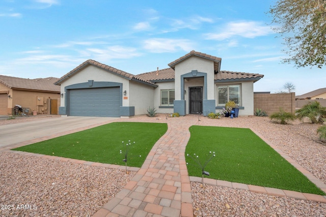 mediterranean / spanish home featuring fence, stucco siding, concrete driveway, a garage, and a tile roof