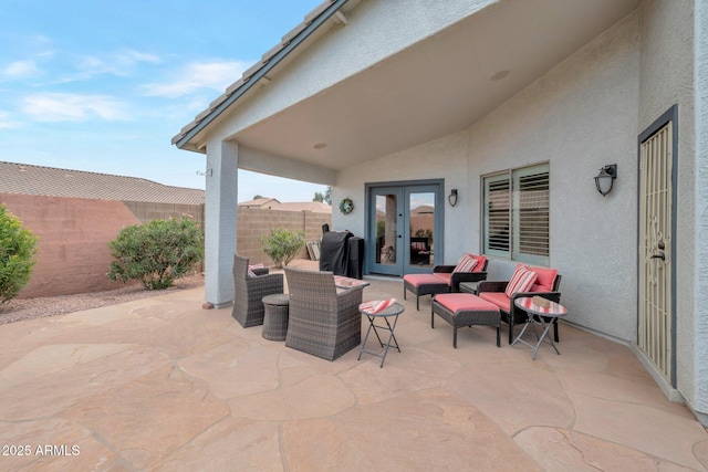 view of patio / terrace featuring french doors, a grill, and a fenced backyard