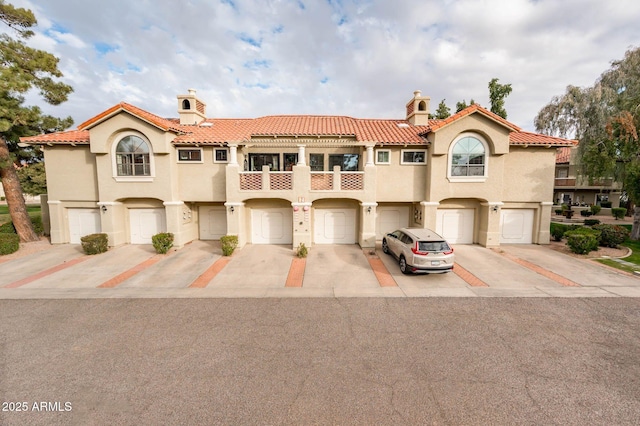 mediterranean / spanish-style house with a balcony