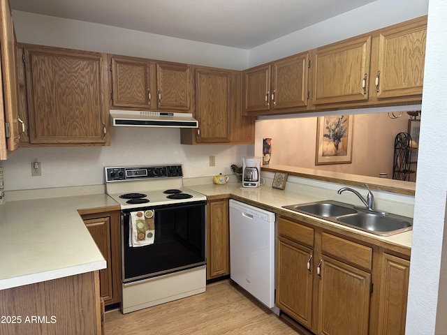 kitchen featuring sink, range with electric cooktop, kitchen peninsula, and dishwasher