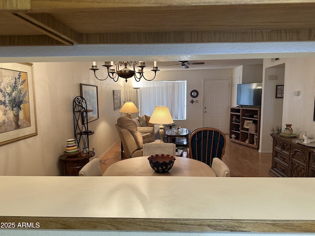 dining area featuring wood-type flooring and ceiling fan