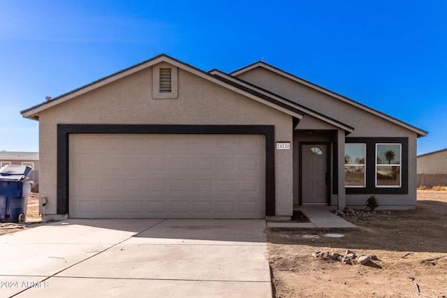 ranch-style house featuring a garage