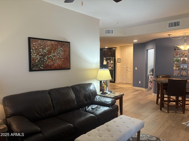 5350 E Deer Valley Dr Unit 3267, Phoenix, AZ 85054 - living area with ceiling fan, light wood-type flooring, recessed lighting, and baseboards