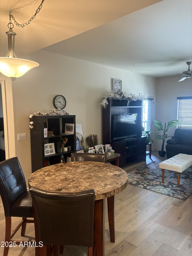 5350 E Deer Valley Dr Unit 3267, Phoenix, AZ 85054 - dining area featuring light wood-style flooring and a ceiling fan
