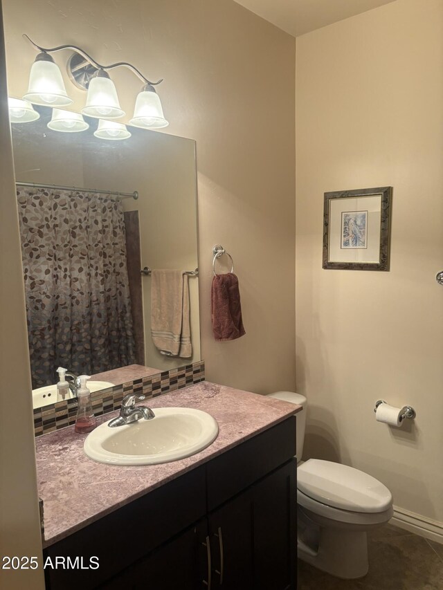 5350 E Deer Valley Dr Unit 3267, Phoenix, AZ 85054 - bathroom with vanity, toilet, decorative backsplash, and curtained shower