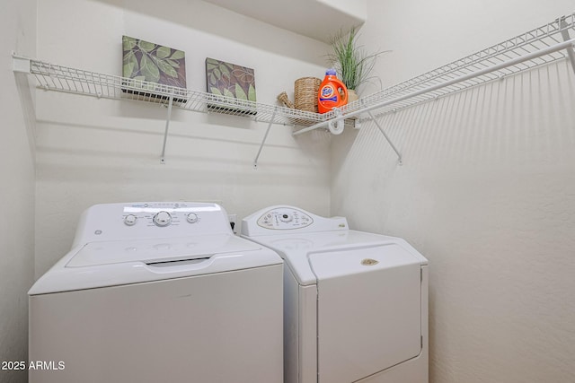 washroom featuring independent washer and dryer