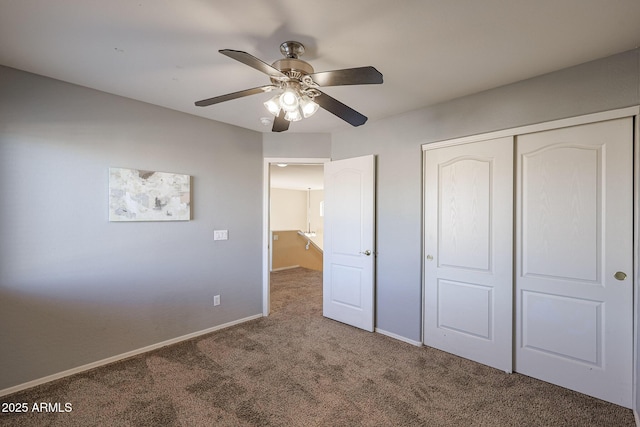 unfurnished bedroom with a closet, ceiling fan, and carpet flooring