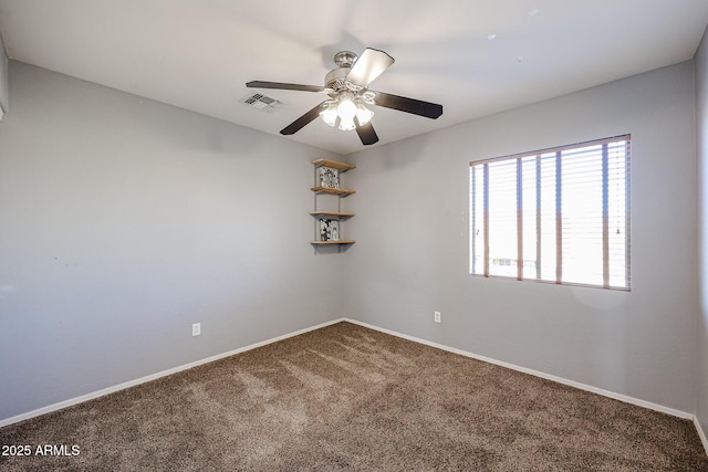 carpeted empty room featuring ceiling fan